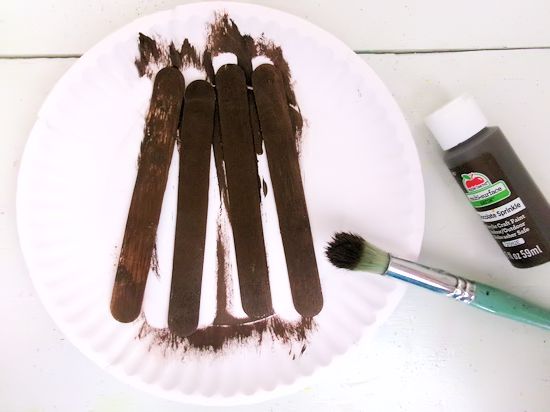 Paint jumbo craft sticks brown.