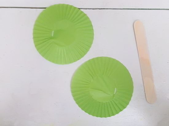 Flatten two cupcake liners per monster.