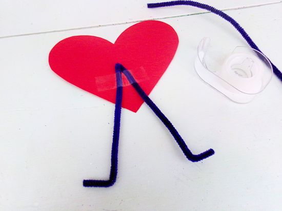 Tape bent pipe cleaner to bottom of heart.